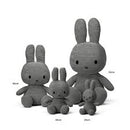A group of three gray stuffed rabbits of different sizes, with the largest one being the tallest and the smallest being the shortest.