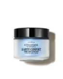 a jar of body cream with a black lid and a white body cream.
