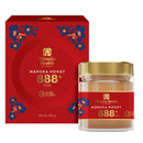 a red box and a jar of Manuka Honey.