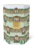 The image is a box for a fragrance discovery set, featuring a winter scene with a house and trees.