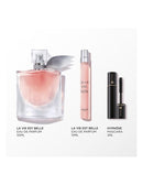 a collection of beauty products, including a perfume bottle, a makeup tube, and a mascara tube, arranged on a white background.