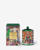 a green tin can with a winter wonderland illustration and a box with a winter wonderland illustration.