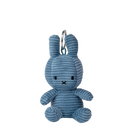 A blue plush rabbit toy is sitting on a black background.