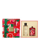 a set of two products from the brand Glasshouse, including a box and a bottle, both with a festive design.
