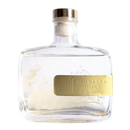 A clear glass bottle with a gold label that reads "BLUEJACAR HOME Fragrance Diffuser".
