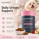The image is an advertisement for a product called "AUINPET Daily Urinary Support" for cats and dogs. It features a close-up of a dog and a cat, along with a pink and black color scheme. The product is described as a "Natural ingredients" and "Made in Australia", and it is shown in a close-up shot. The product is also shown in a bowl of treats, highlighting its appeal to picky pets.
