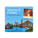 The image is a product packaging for Vitamin E Cream with Shea Butter and Collagen, featuring a cityscape and a stamp from Australia.