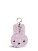 A small, plush keychain in a light purple color.