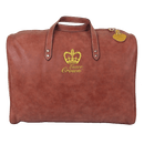 A brown leather tote bag with a gold crown logo and the text "Luxor Crown" printed on it.