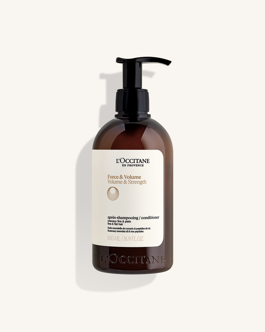A brown bottle of L'Occitane Force & Volume Volume & Strength shampoo and conditioner.