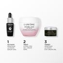 three Lancome skincare products: a bottle of Lancome Genifique Ultimate Gel Cream, a bottle of Lancome Hydra Zen GEL CREAM, and a bottle of Lancome Genifique Ultimate Eye Cream.