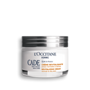 a jar of cream with a silver lid, labeled as a "CADE" product.