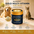 a cat and a dog sitting on a bed next to a jar of gold multi