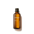 A bottle of Jurlique rose body oil against a white background.