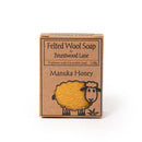 A cardboard box containing a product called "Manuka Honey" by Bruntwood Lane. The box features a sheep illustration and text indicating that the product is "Feltted Wool Soap" and is "Exfoliate with Carrieddale seed".
