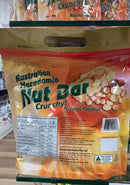 A bag of crunchy natural nut bar snacks is displayed on a shelf.