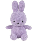 A purple plush bunny toy with large ears and a black x on its face.