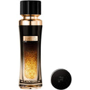 a black and gold perfume bottle with a gold glittery liquid inside.