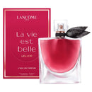 a red box and a clear glass perfume bottle with a black leaf-shaped cap, both labeled with the text "La vie est belle L'éux de parfum".