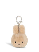 A small, plush keychain in the shape of a bunny with a silver clasp.
