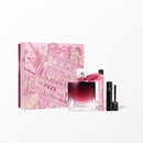 a pink box with a pink and gold design, containing a perfume bottle, a mascara tube, and a lipstick tube.