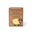 A cardboard box containing a bar of felt sheep soap.