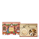 a box with a Christmas-themed illustration and a decorative fan, along with a fan and a small plate.