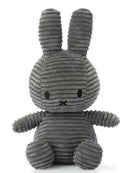 A gray, plush rabbit toy with large ears and a small nose.