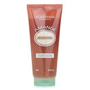 A tube of L'Occitane Amande shower scrub with a green cap.
