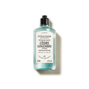 A bottle of L'Occtane cedre gingembre liquid soap, with a black cap and white label.