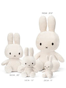 A collection of four white stuffed rabbits of different sizes, ranging from 50 cm to 23 cm in height.