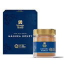 a jar of Manuka Honey next to its packaging box.