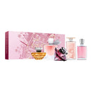 a collection of five perfume bottles, each with a unique design and color, displayed in a pink box with a pink and gold illustration.