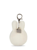 A white plush keychain in the shape of a bunny with a metal clasp and a small tag attached.