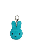 A teal-colored plush rabbit charm with a silver metal clasp attached to it.