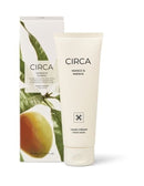 a product called "CIRCA Mango & Papaya Hand Cream" with a tube and a box. The product is a hand cream that contains mango and papaya. The box is white and has a green leaf design, and the tube is white and has a black and white design.