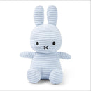 A light blue stuffed bunny toy with large ears and a black x on its face.