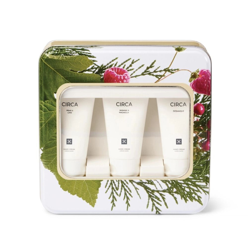 A set of three cylindrical tubes of cream, each labeled with the brand name "CIRCA" and the product type "Hand Cream". The tubes are arranged in a row, with the first one being larger than the other two. The packaging features a floral design with green leaves and pink flowers, creating a visually appealing presentation.