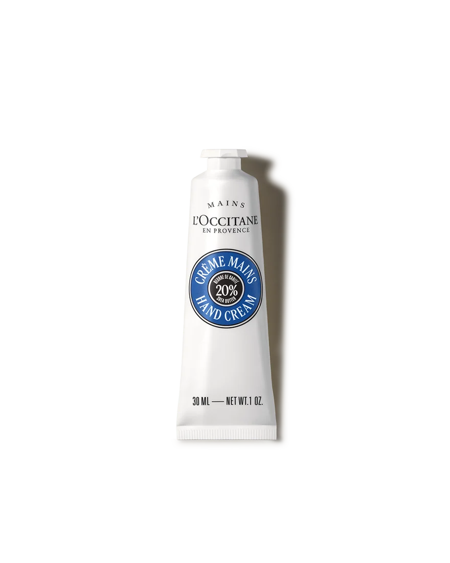 A tube of hand cream against a black background.
