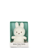 A white plush bunny toy is displayed in a green box with the text "BON TON TOYS EST. 1933".