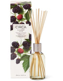a glass diffuser with a clear glass jar filled with blackberry and plum-scented oil, accompanied by its packaging box.
