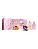 a collection of five perfume bottles, each with a different color and design, displayed in a pink box with a pink and white floral pattern.