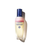 A bottle of L'Occ Tannerne en Provence, a liquid foundation with a yellow and pink gradient, and a blue cap.