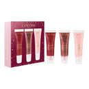 a set of four tubes of lipstick from the Lancome brand, arranged in a row.
