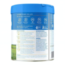 The image is a blue can with text and images, including a grassy field and a blue sky.