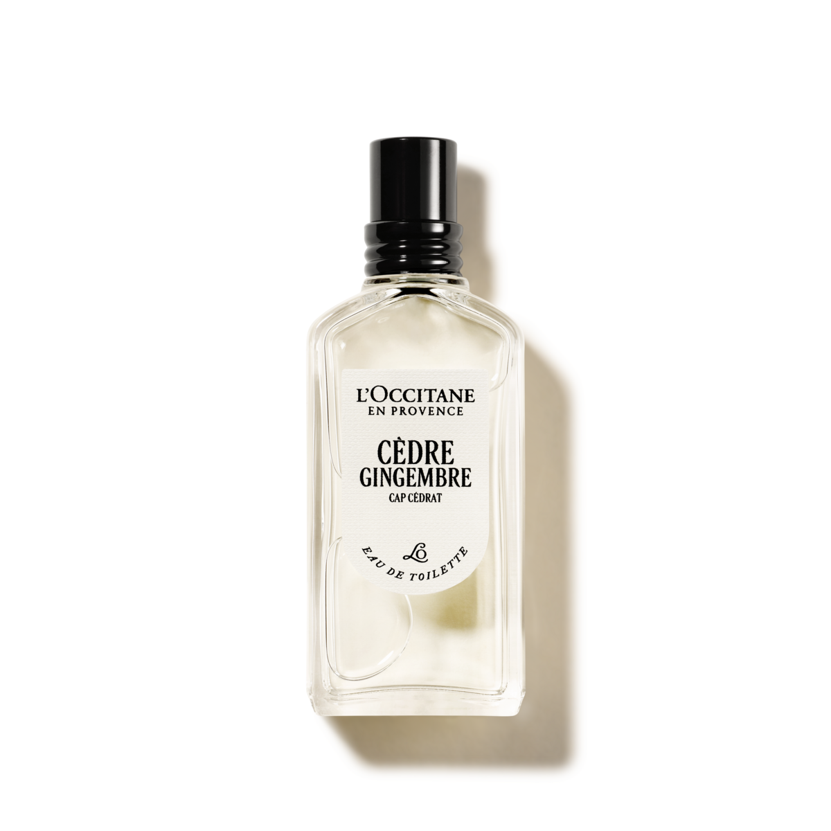 A bottle of L'OCCITANE en PROVENCE CEDRE GINGEMBRE CAPÉLÉTAE, a fragrance for men, is shown against a black background.