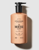 a bottle of L'Occitane en Provence product called "La Mousse Karite" with a pump dispenser.