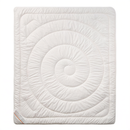a white, square-shaped bedding item with a spiral pattern on it.