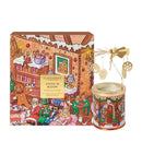 a gingerbread house-themed candle and a box with a gingerbread house illustration.