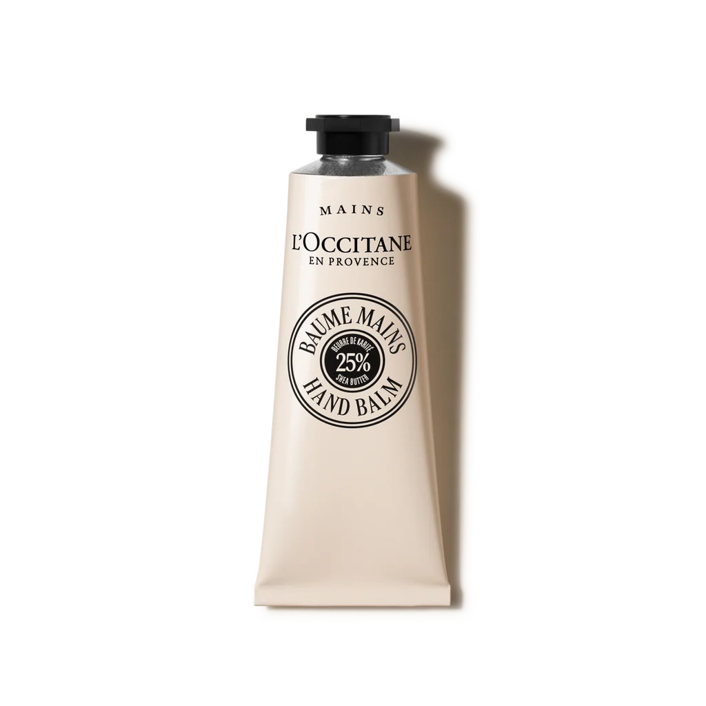 a tube of hand balm with a black cap and a white label.